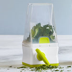 Herb keeper with fresh herbs on a light wooden surface.