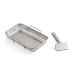 Stainless steel mesh basket and spatula on a white background