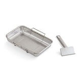 Stainless steel mesh basket and spatula on a white background