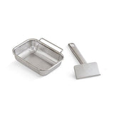Stainless steel mesh grill pan and slotted spatula on a white background