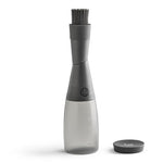 Gray kitchen basting brush on bottle attachment on a white background