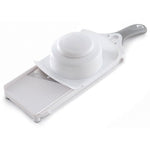 White mandoline slicer with a white bowl on a white background.