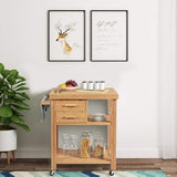 Bamboo wooden kitchen cart with fruit bowl, spices, and wine glasses in a room with framed pictures on the wall.
