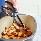 Salad Chopper being used to cut chicken pieces in a pot.