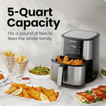 Air fryer with food items on a table, highlighting its 5-quart capacity.