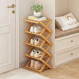 Wooden shoe rack with shoes on a wooden floor next to a door and sitting area.