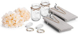 Set of jars, flowers, and wooden items on a white background