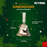 Christmas bell ornament with dimensions on a green background.