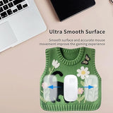 Green mouse pad with floral design on a desk with text about its benefits