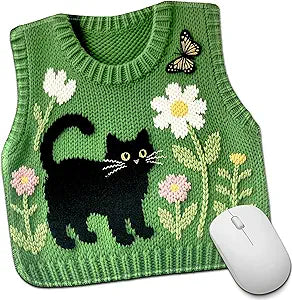 Mouse pad designed as a green, knitted vest with black cat and floral design on a white background.