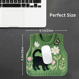 Green knitted vest designed mouse pad with floral and butterfly design featuring a black cat ~ placed by a laptop for size reference.