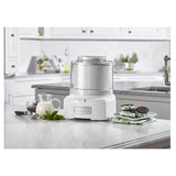 Cuisinart Frozen Yogurt Ice Cream & Sorbet Maker on kitchen counter with mint and mint ice cream sandwiches.