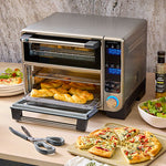 Deluxe Air Fryer and Toaster Oven with pizzas and bread on a countertop.