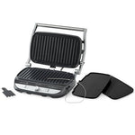Black and silver grill with two additional grilling plates on a white background.