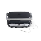 Black and silver grill with digital display on a white background.
