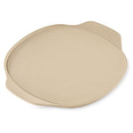 Beige, large, round pizza stoneware on a white background.