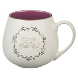 White mug with purple interior and 'Come, All Ye Faithful' text on a white background