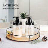 Bathroom soap dispenser set with black pumps on a wooden tray in a bathroom setting.
