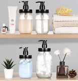 Plastic mason jar bottles with black pumps on a shelf with various items.