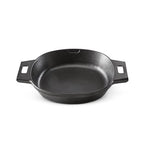 Black cast iron skillet on a white background.