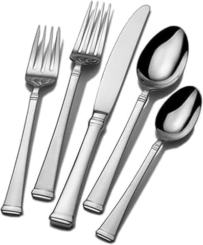 Set of silver cutlery including forks, knives, and spoons on a white background