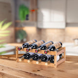 Bamboo wine rack with bottles on a kitchen counter.