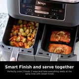 Ninja foodi appliance with two compartments cooking vegetables and salmon, labeled 'Smart Finish and serve together'.