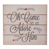 Wooden sign with Christmas-themed text and decorations on a white background