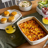 Dish of casserole with biscuits and drinks on a table