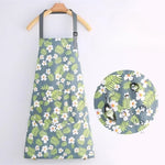 Light blue and green floral apron with wide pocket and adjustable straps.