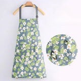 Light blue and green floral apron with wide pocket and adjustable straps.