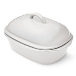 White satin glazed stoneware covered baking dish with lid on a white background.