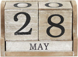 Wooden calendar blocks displaying '28 May' on a wooden stand.