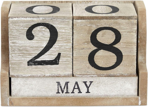 Wooden calendar blocks displaying '28 May' on a wooden stand.